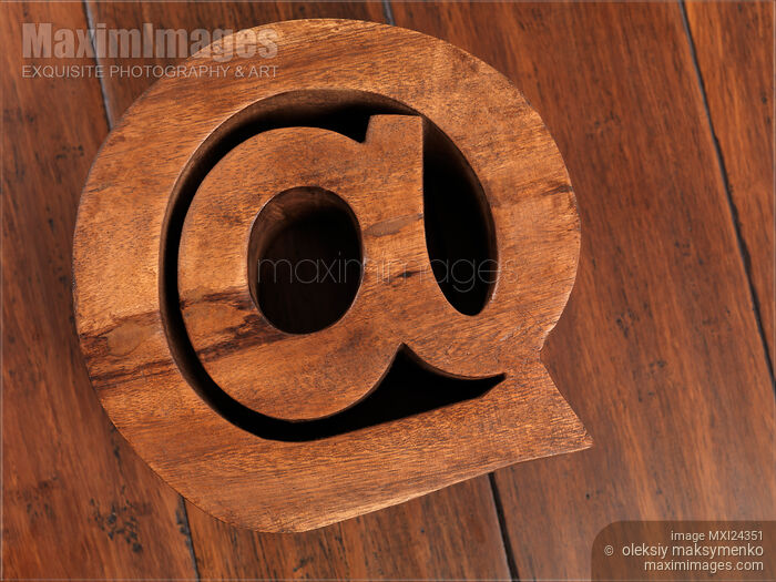 Stock photo of Internet and email symbol at made of wood Buy commercial use license at MaximImages