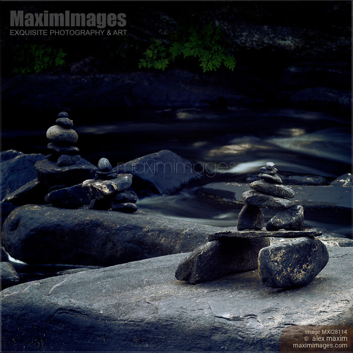 Inuksuk stone figures and river Stock photo of Inuksuk stone figures and river Buy commercial use license at MaximImages