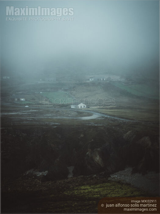 Stock photo of Isolated house in dark moody foggy countryside landscape scenery in Sligo Ireland Buy commercial use license at MaximImages