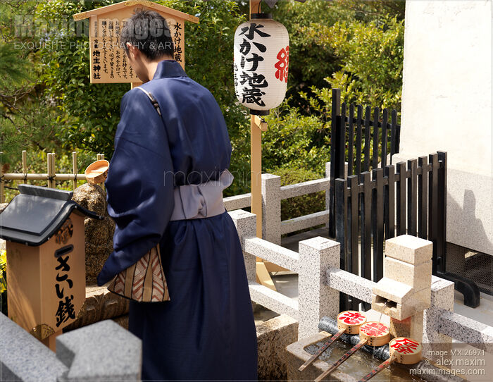 Stock photo of Japanese man at Jishu Jinja shrine of love and marriage at Kiyomizu-dera in Kyoto Buy commercial use license at MaximImages