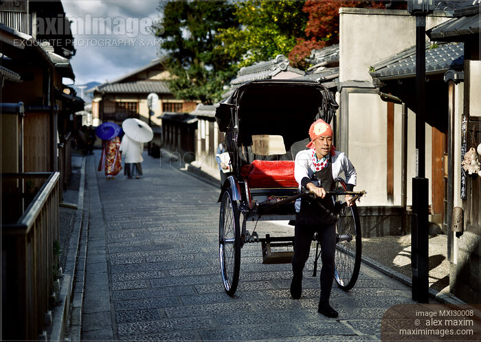 Stock photo of Japanese rickshaw on an old street in Kyoto Japan Buy commercial use license at MaximImages