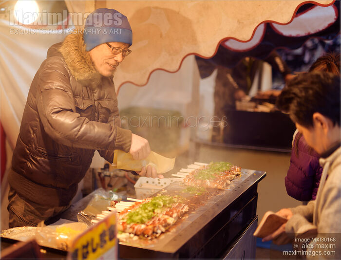 Stock photo of Japanese street food vendor selling Hashimaki at a food market in Kyoto Buy commercial use license at MaximImages