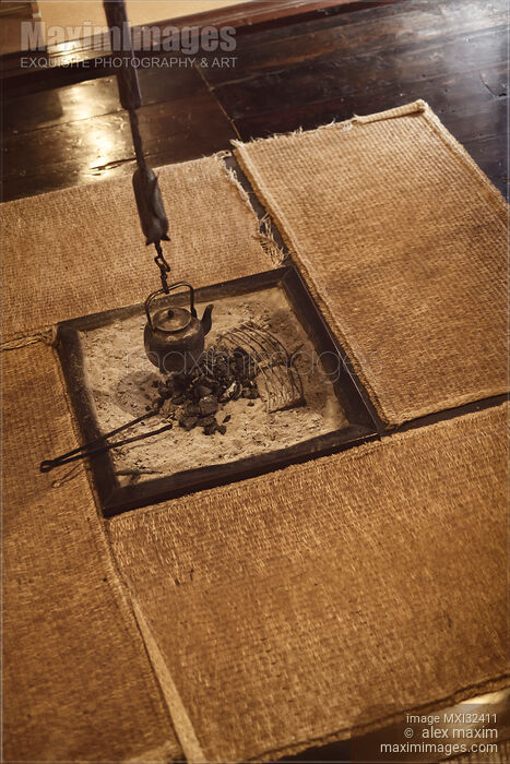 Japanese tea room with a kettle hanging above in a sunken hearth and straw mats around Stock photo of Japanese tea room with a kettle hanging above in a sunken hearth and straw mats around Buy commercial use license at MaximImages