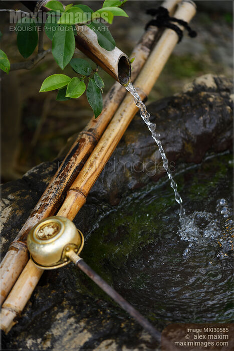 Japanese water cleansing basin with bamboo elements showing Wabi-Sabi philosophy of finding beauty in natural and imperfect Stock photo of Japanese water cleansing basin with bamboo elements showing Wabi-Sabi philosophy of finding beauty in natural and imperfect Buy commercial use license at MaximImages