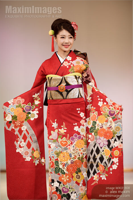 Japanese woman in a beautiful red kimono with a colorful pattern at a fashion show in Kyoto Stock photo of Japanese woman in a beautiful red kimono with a colorful pattern at a fashion show in Kyoto Buy commercial use license at MaximImages