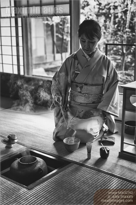 Stock photo of Japanese woman tea ceremony master making matcha in traditional tea house Ochaya Black and white portrait Buy commercial use license at MaximImages