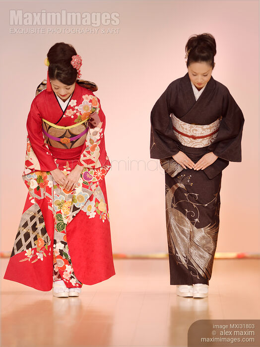 Japanese women in elegant kimonos bowing at a fashion show Stock photo of Japanese women in elegant kimonos bowing at a fashion show Buy commercial use license at MaximImages