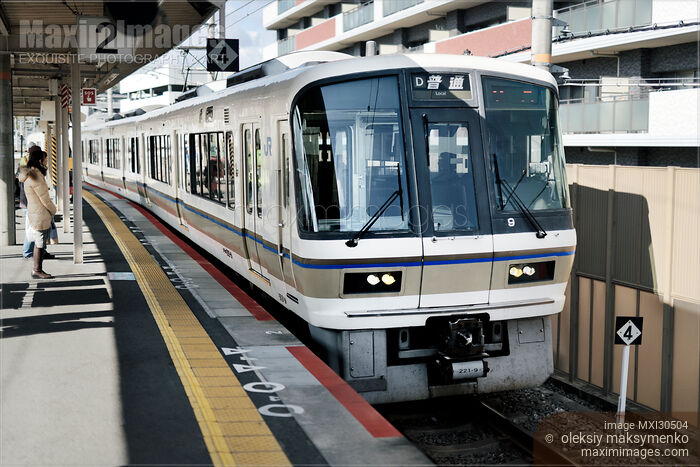 JR train arriving to a station platform in Japan Stock photo of JR train arriving to a station platform in Japan Buy commercial use license at MaximImages