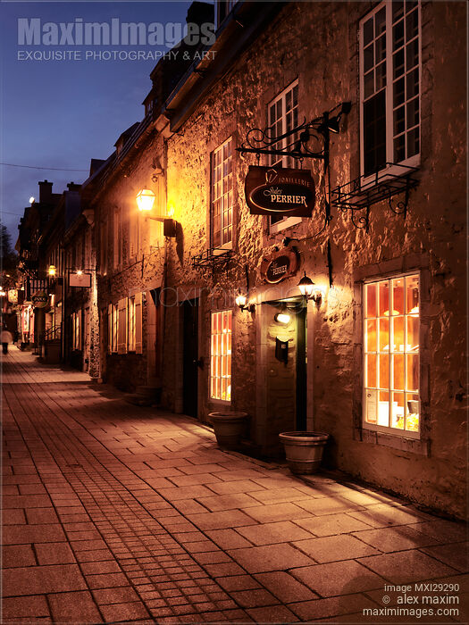 Stock photo of Jules Perrier and other shops lit with street light at night in Old Quebec City Buy commercial use license at MaximImages