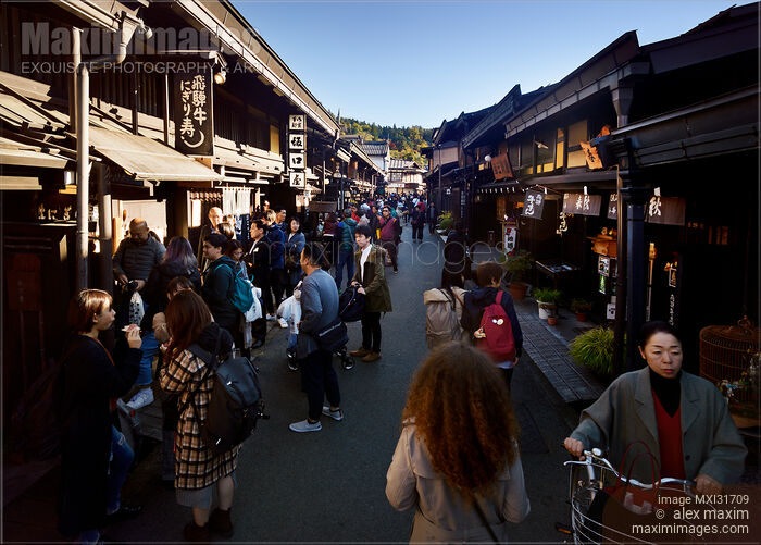 Kamisannomachi old merchant town street in Takayama Japan lined with shops and restaurants busy with tourists Stock photo of Kamisannomachi old merchant town street in Takayama Japan lined with shops and restaurants busy with tourists Buy commercial use license at MaximImages