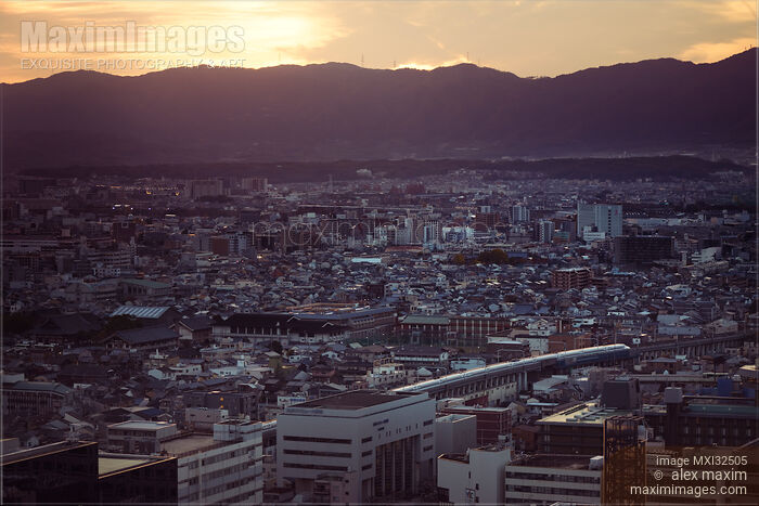 Kyoto aerial sunset city scenery landscape with departing Shinkansen train and mountains Stock photo of Kyoto aerial sunset city scenery landscape with departing Shinkansen train and mountains Buy commercial use license at MaximImages