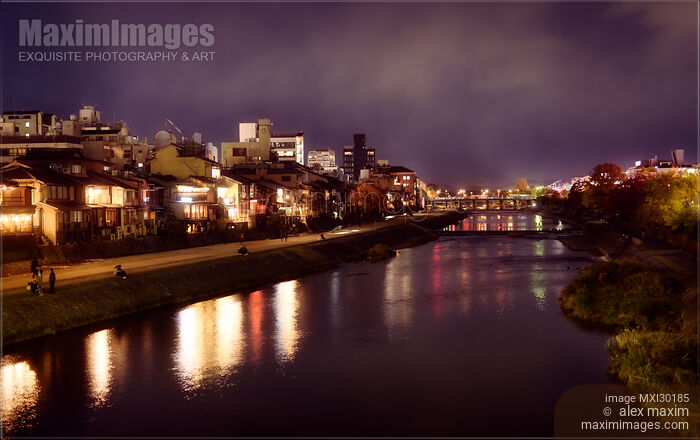 Stock photo of Kyoto nighttime city scenery of Kamo River with street lights reflecting in water Buy commercial use license at MaximImages