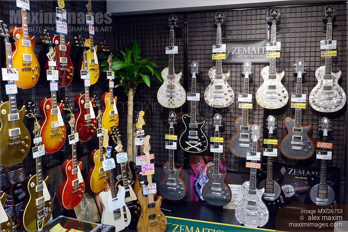 Stock photo of Les Paul guitars in a store Buy commercial use license at MaximImages