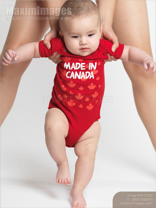 Stock photo of Little Baby Learning to Walk Buy commercial use license at MaximImages