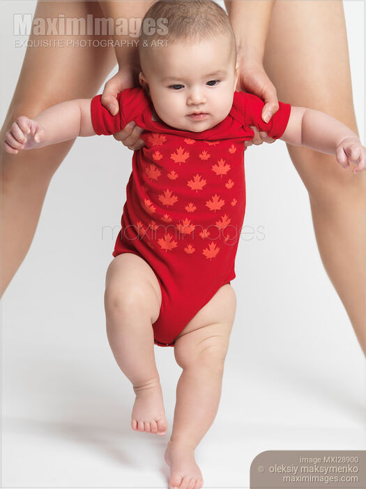 Stock photo of Little Baby Learning to Walk Buy commercial use license at MaximImages