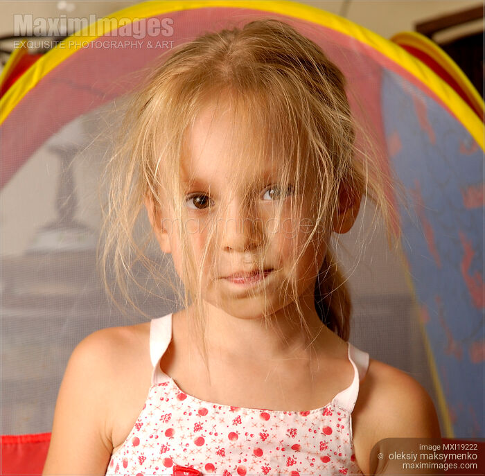 Stock photo of Little girl with messed hair Buy commercial use license at MaximImages