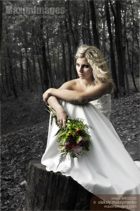 Stock photo of Lonely Bride in Wedding Dress Alone in the Woods Buy commercial use license at MaximImages