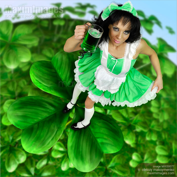 Stock photo of Lovely Irish Girl with a Glass of Green Beer Buy commercial use license at MaximImages