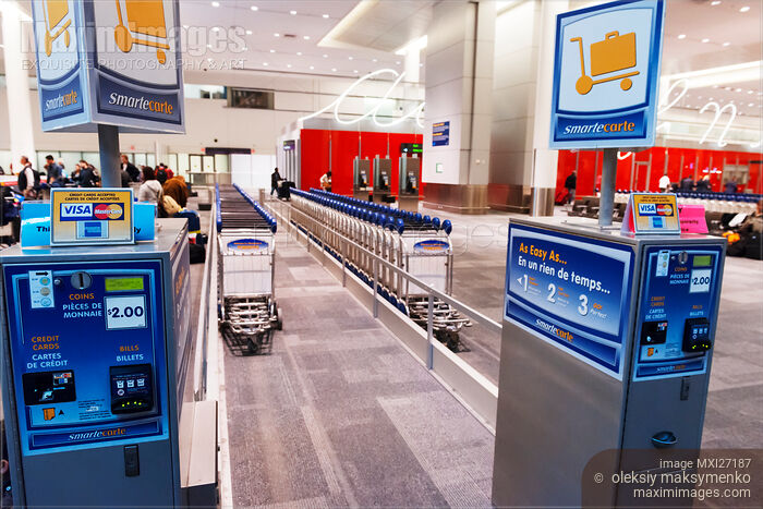 Stock photo of Luggage carts at an airport Buy commercial use license at MaximImages