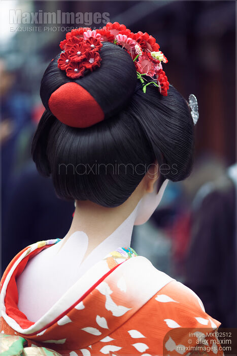 Maiko Geisha in bright red kimono back of her neck makeup and traditional hairstyle wig with kanzashi Stock photo of Maiko Geisha in bright red kimono back of her neck makeup and traditional hairstyle wig with kanzashi Buy commercial use license at MaximImages