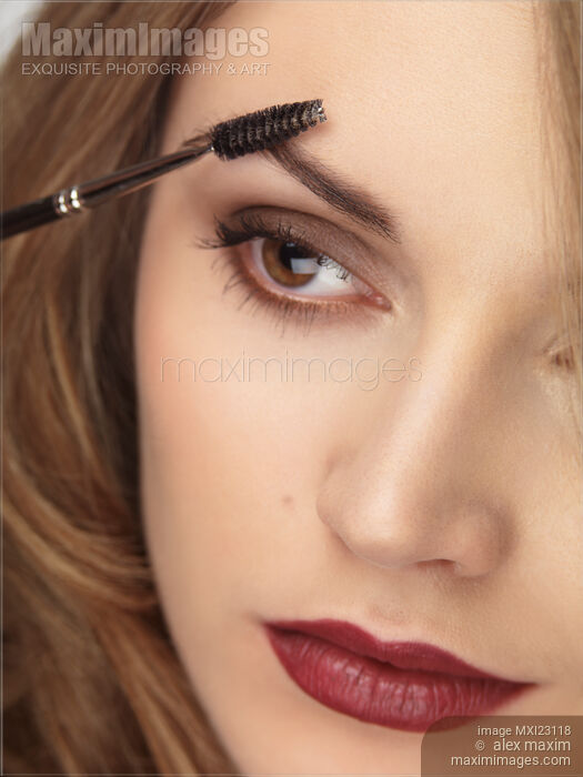 Makeup Being Applied to Womans Face Stock photo of Makeup Being Applied to Womans Face Buy commercial use license at MaximImages
