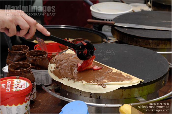 Stock photo of Making Crepes Pancakes Buy commercial use license at MaximImages