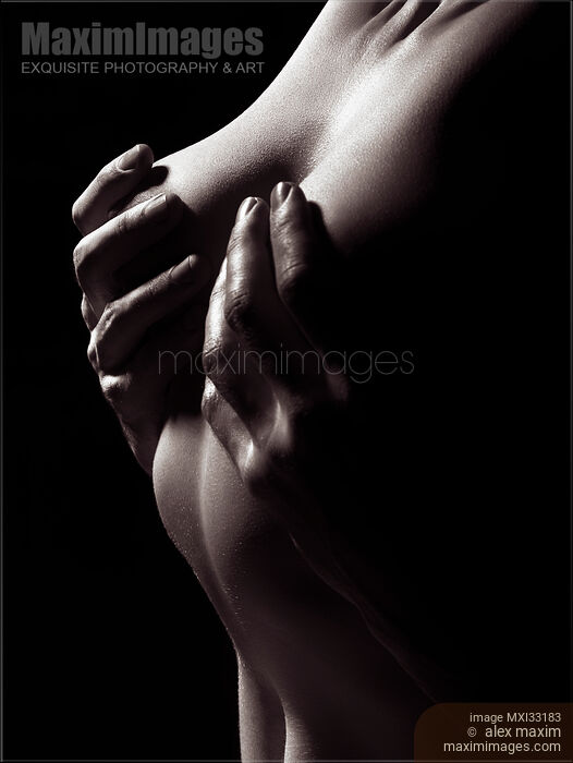 Male hands covering naked woman breasts, abstract fine art nude body parts of a couple making love. Stock photo of Male hands covering naked woman breasts, abstract fine art nude body parts of a couple making love. Buy commercial use license at MaximImages