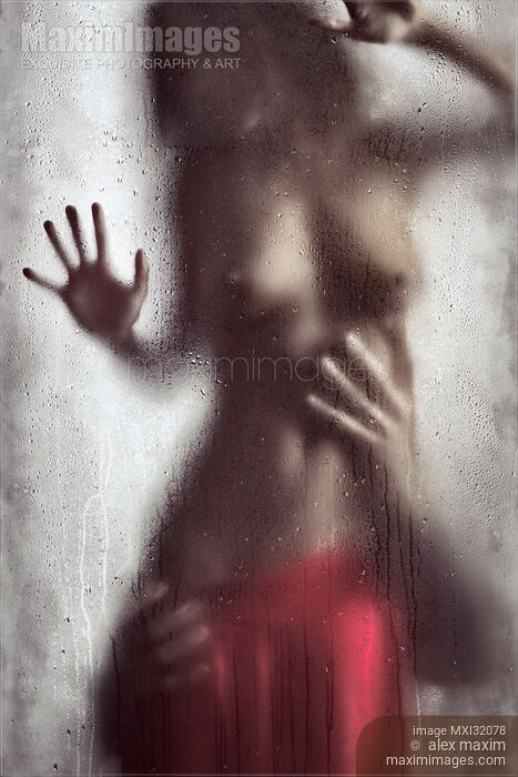 Stock photo of Man hands caressing woman half naked body Sensual couple behind wet glass Buy commercial use license at MaximImages