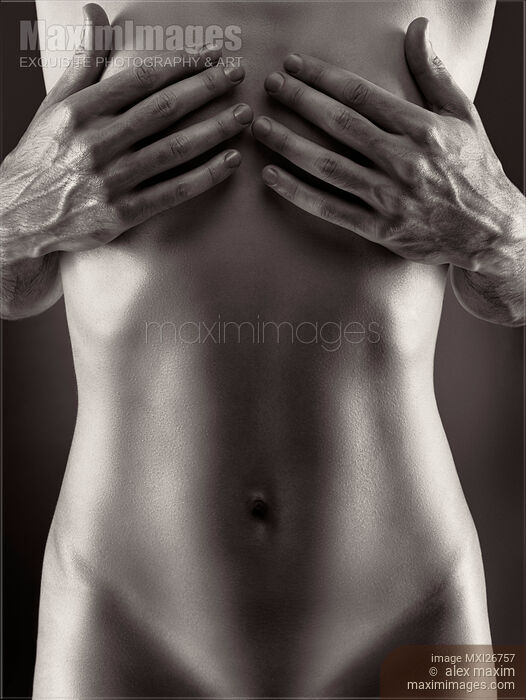Man hands covering nude woman breasts black and white Stock photo of Man hands covering nude woman breasts black and white Buy commercial use license at MaximImages