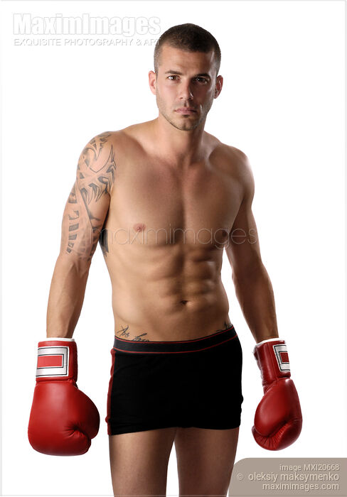 Stock photo of Man kickboxer With bare torso and boxing gloves Buy commercial use license at MaximImages