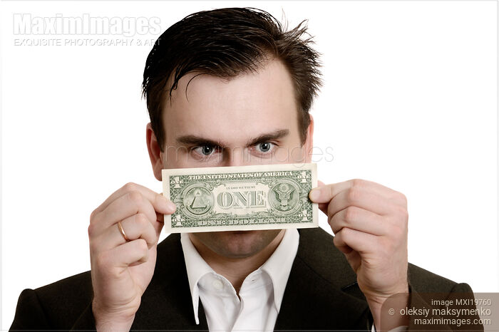 Stock photo of Man Staring at One Dollar Bill in His Hands Buy commercial use license at MaximImages