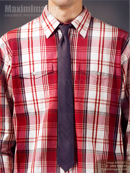 Stock photo of Man wearing red tartan shirt with a skinny necktie Buy commercial use license at MaximImages