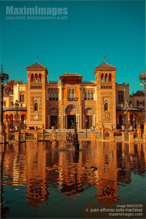 Stock photo of Maria Luisa Park with historic buildings by a pond in Seville Spain Buy commercial use license at MaximImages