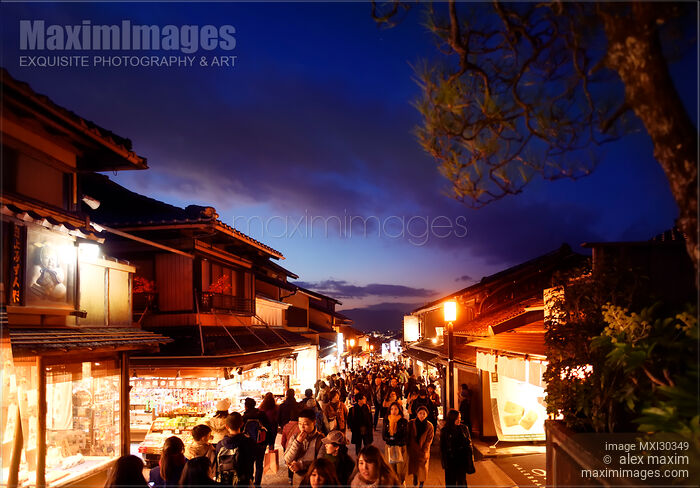 Stock photo of Matsubara dori street in Kyoto at night full of people and bright lights Japan Buy commercial use license at MaximImages