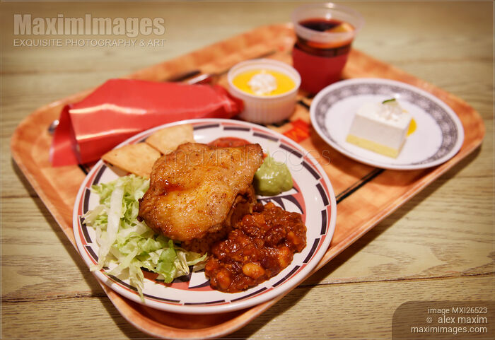 Stock photo of Mexican dish chicken and beans at restaurant Buy commercial use license at MaximImages