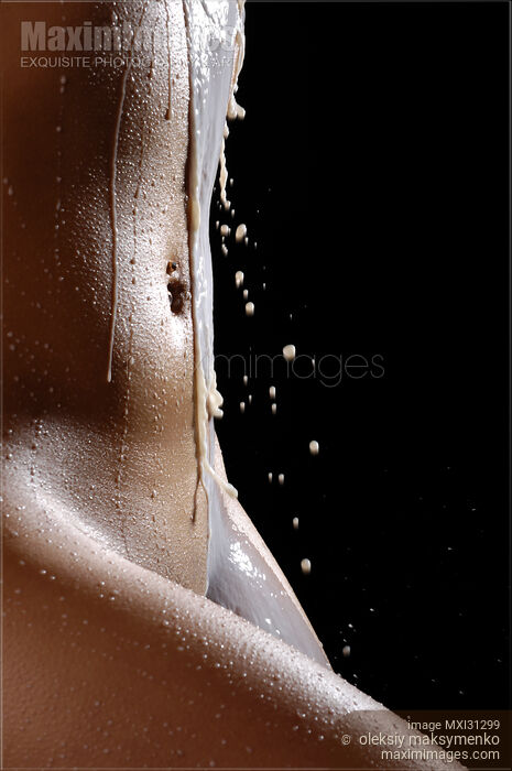 Stock photo of Milk Dripping over Nude Woman Body Buy commercial use license at MaximImages