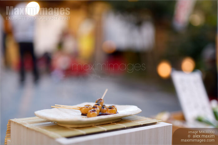 Mitarashi Dango steaming Japanese sweet grilled dumpling balls on a skewer food still life Stock photo of Mitarashi Dango steaming Japanese sweet grilled dumpling balls on a skewer food still life Buy commercial use license at MaximImages