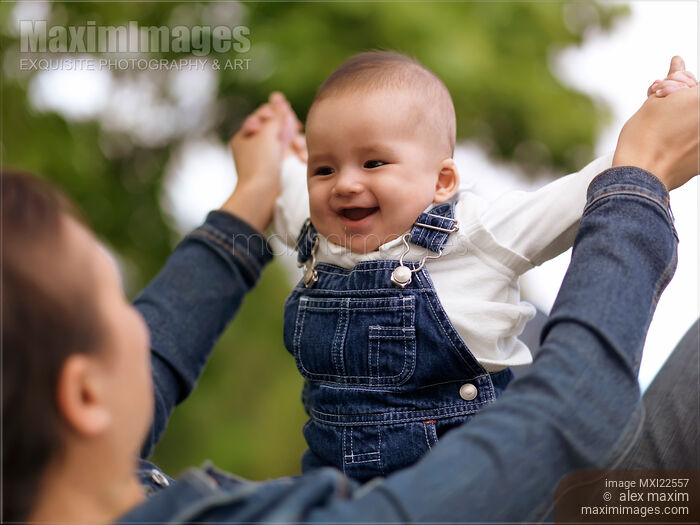 Stock photo of Mother Playing with a Baby Buy commercial use license at MaximImages