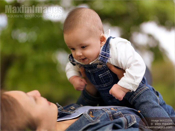 Stock photo of Mother Playing with a Baby Buy commercial use license at MaximImages