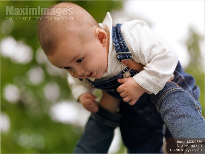 Stock photo of Mother Playing with a Baby Buy commercial use license at MaximImages