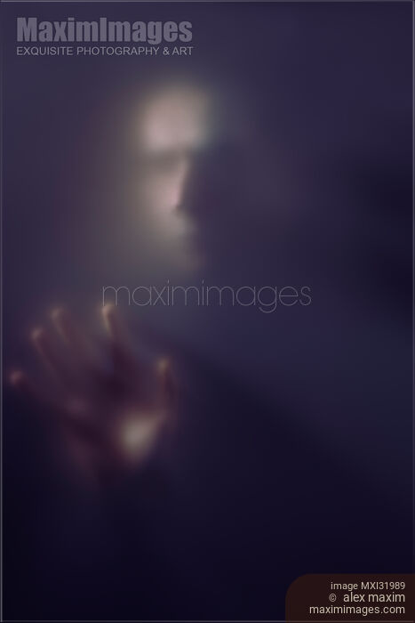 Mysterious portrait of a creepy man ghostly blurred face and hand reaching from darkness through a haze of fog Stock photo of Mysterious portrait of a creepy man ghostly blurred face and hand reaching from darkness through a haze of fog Buy commercial use license at MaximImages