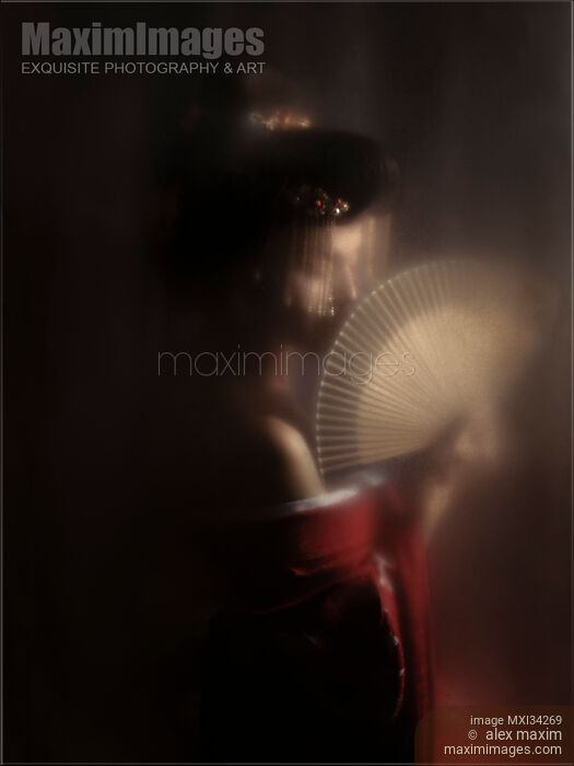 Mysterious portrait of beautiful Japanese geisha or courtesan Oiran with hand fan behind hazy screen Stock photo of Mysterious portrait of beautiful Japanese geisha or courtesan Oiran with hand fan behind hazy screen Buy commercial use license at MaximImages