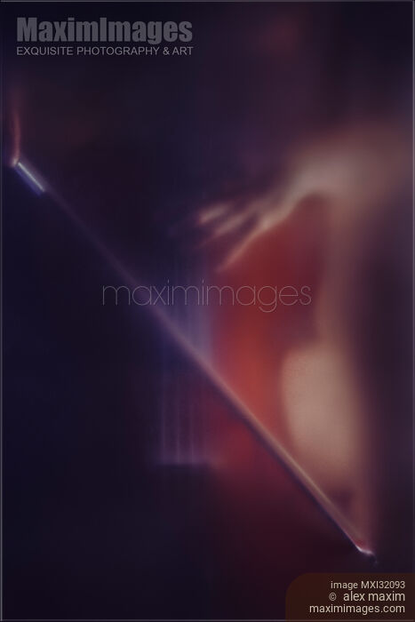 Mysterious romantic concept of a woman playing cello in dark dream-like haze behind blurry glass Stock photo of Mysterious romantic concept of a woman playing cello in dark dream-like haze behind blurry glass Buy commercial use license at MaximImages
