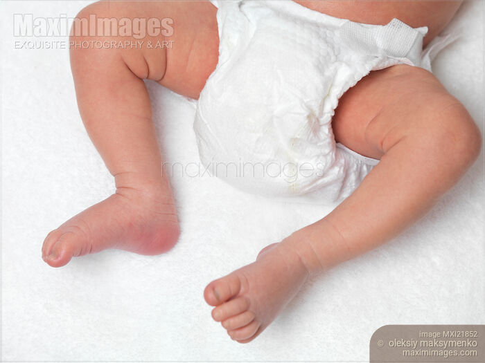Stock photo of Newborn Baby in a Diaper Buy commercial use license at MaximImages