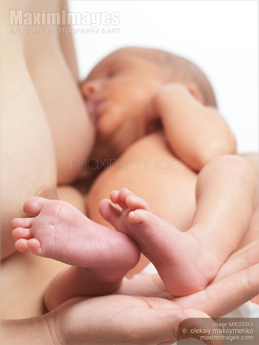 Stock photo of Newborn baby sleeping in mother arms Buy commercial use license at MaximImages