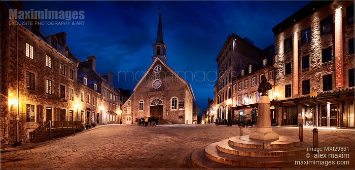 Stock photo of Nighttime view of Notre-Dame-des-Victoires Church and statue of Louis XIV in Place Royale in Old Quebec City Buy commercial use license at MaximImages