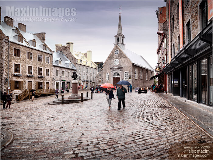 Stock photo of Notre-Dame-des-Victoires Church in Royal Square Place Royale in Old Quebec City on a rainy day Buy commercial use license at MaximImages