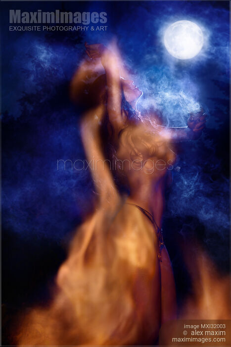 Nude native woman performing shamanic witchcraft ritual dancing by the fire in light of a full moon at night Stock photo of Nude native woman performing shamanic witchcraft ritual dancing by the fire in light of a full moon at night Buy commercial use license at MaximImages