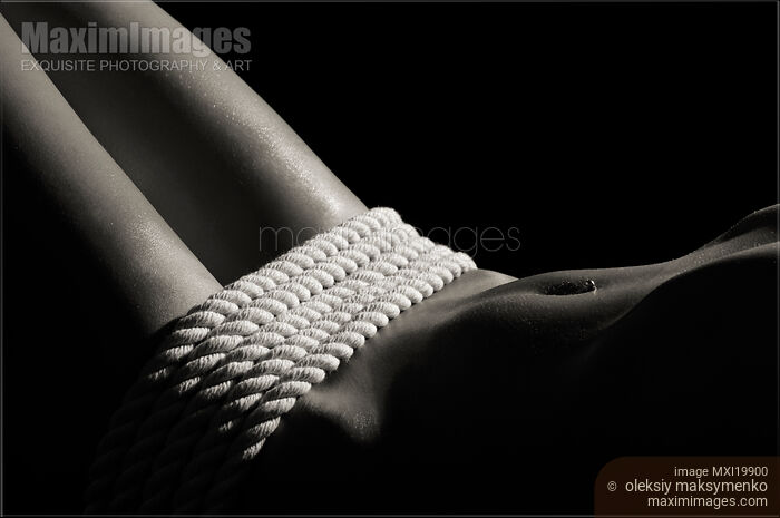 Stock photo of Nude Woman Body and Ropes Buy commercial use license at MaximImages