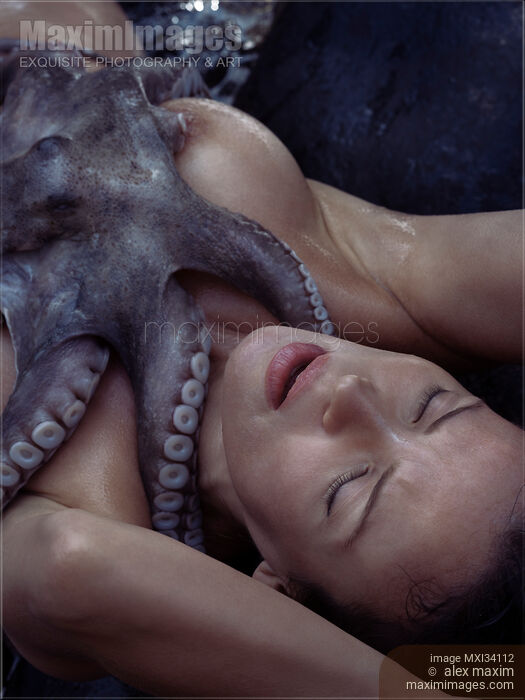 Nude woman lying on a shore with octopus caressing her naked body with tentacles Stock photo of Nude woman lying on a shore with octopus caressing her naked body with tentacles Buy commercial use license at MaximImages